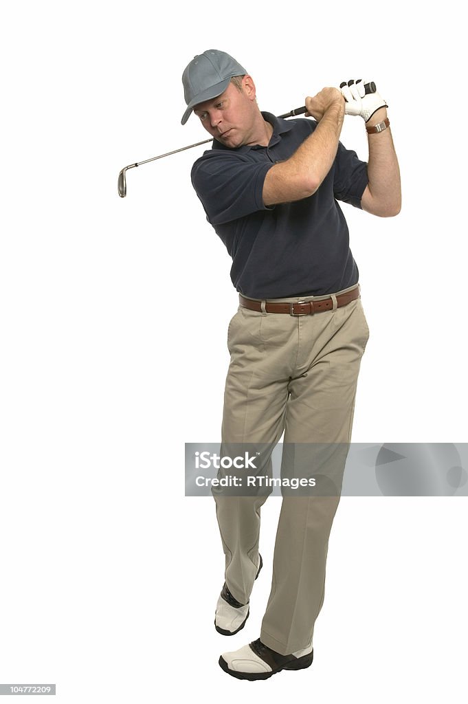 Golfer follow through swing Shot of a golfer during the follow through of his swing using an iron, on a white background. Golfer Stock Photo