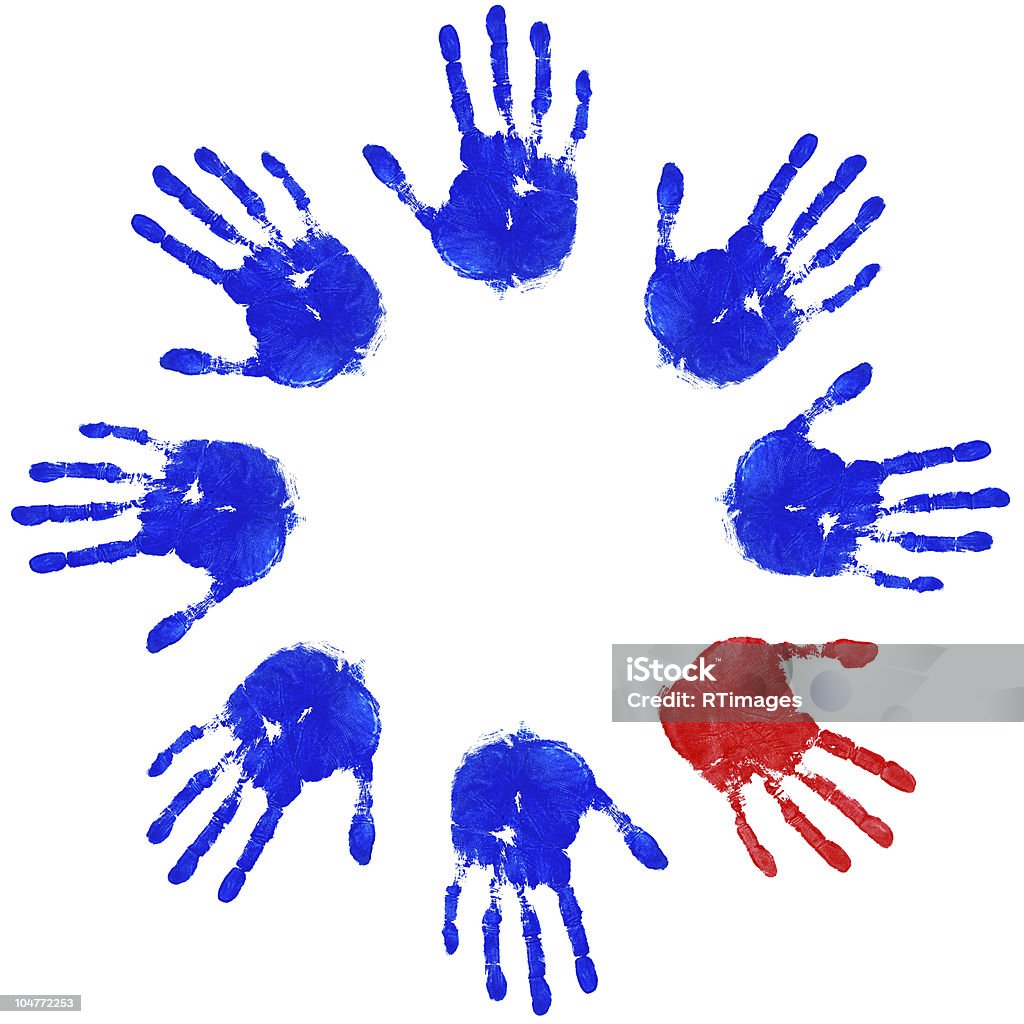 Odd hand circle Images of blue handprints with an odd red one on a white background, concepts of Teamwork, Individuality, Equality and Diversity. Multiracial Group Stock Photo