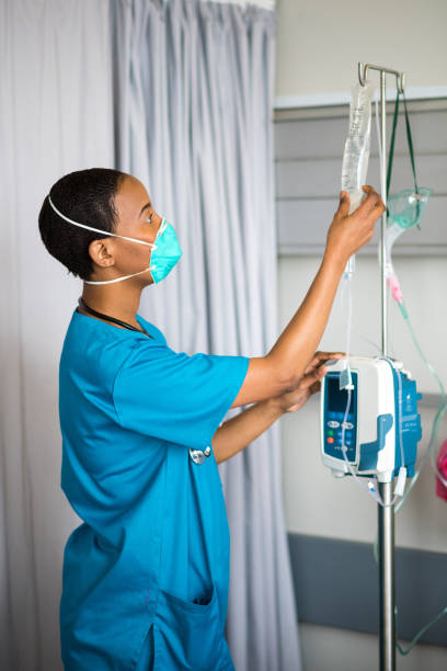istock Front line healthcare worker wearing a protective mask 1047724150