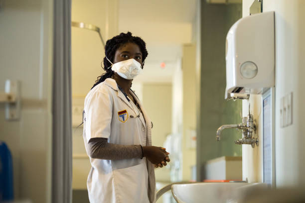 Front line healthcare worker wearing a protective TB mask stock photo