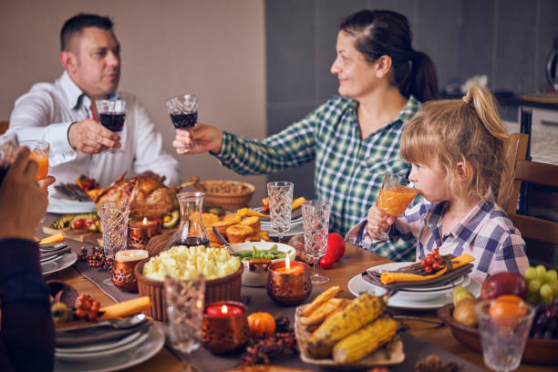 istock Family Having Traditional Holiday Stuffed Turkey Dinner 1047727774