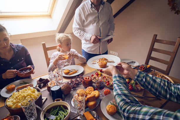 istock Family Having Traditional Holiday Stuffed Turkey Dinner 1047727870