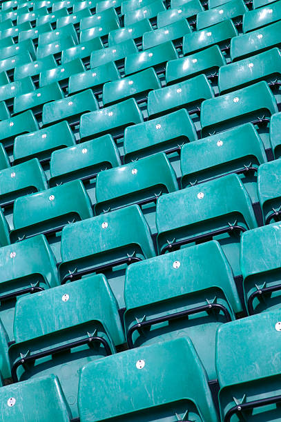 istock Green sports stadium seats 104772809