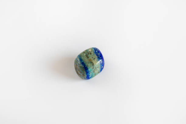 istock Natural mineral stone, blue green gemstone isolated on white 1047731868