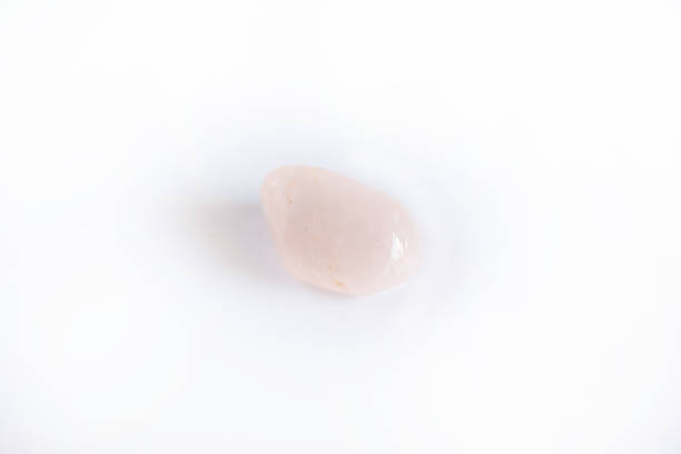 istock Natural gemstone, rose quartz mineral isolated on white background 1047731870