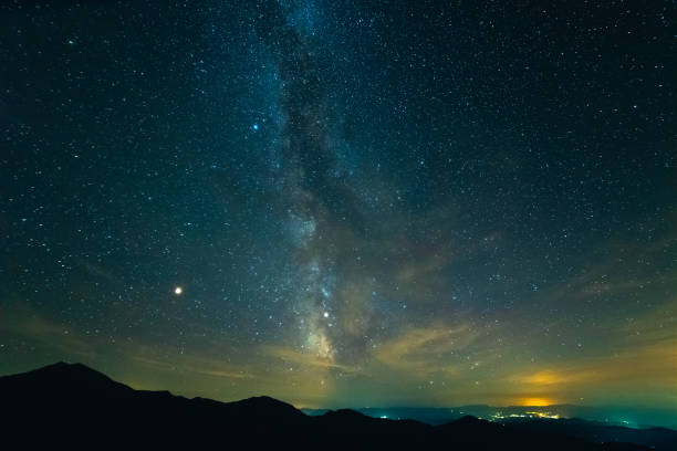 istock The picturesque starry sky above mountains 1047734128