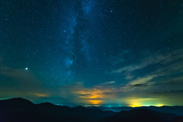 istock The beautiful mountain landscape on the starry sky background 1047735216