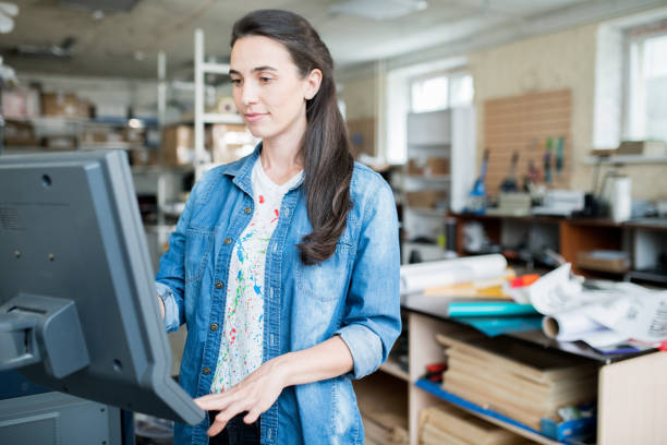 istock Expert of publishing company using touchsceen of printer 1047738856