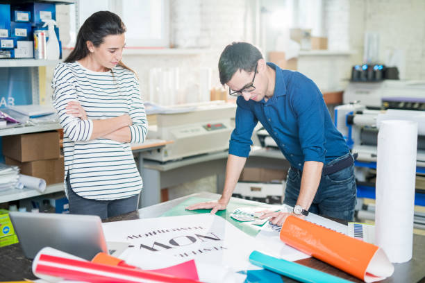 istock Printing banner in advertising company office 1047738930