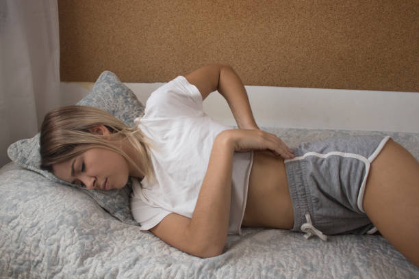 istock Woman wakes up suffering back pain 1047739064