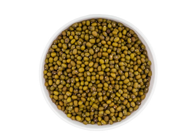 istock Green mung beans in bowl isolated on white background 1047741050