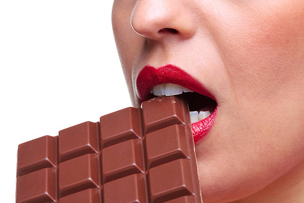 istock Woman eating chocolate 104774199