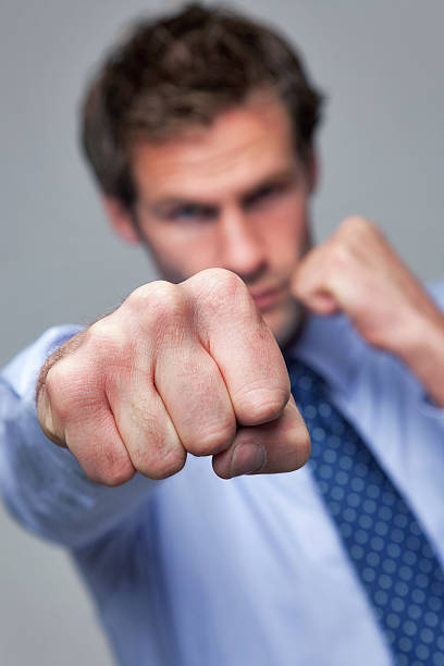 istock Businessman punching towards camera 104774538