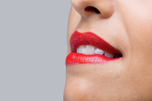 istock Close up woman biting her red lips 104774621