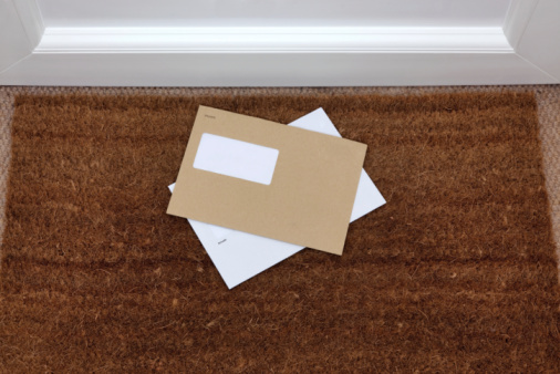 Two envelopes on a doormat, blank window to add your own name and address details.