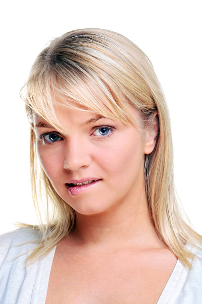 istock Blond woman biting her lip 104774893