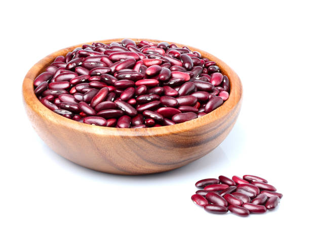 istock Red beans in wooden bowl isolated. 1047749372