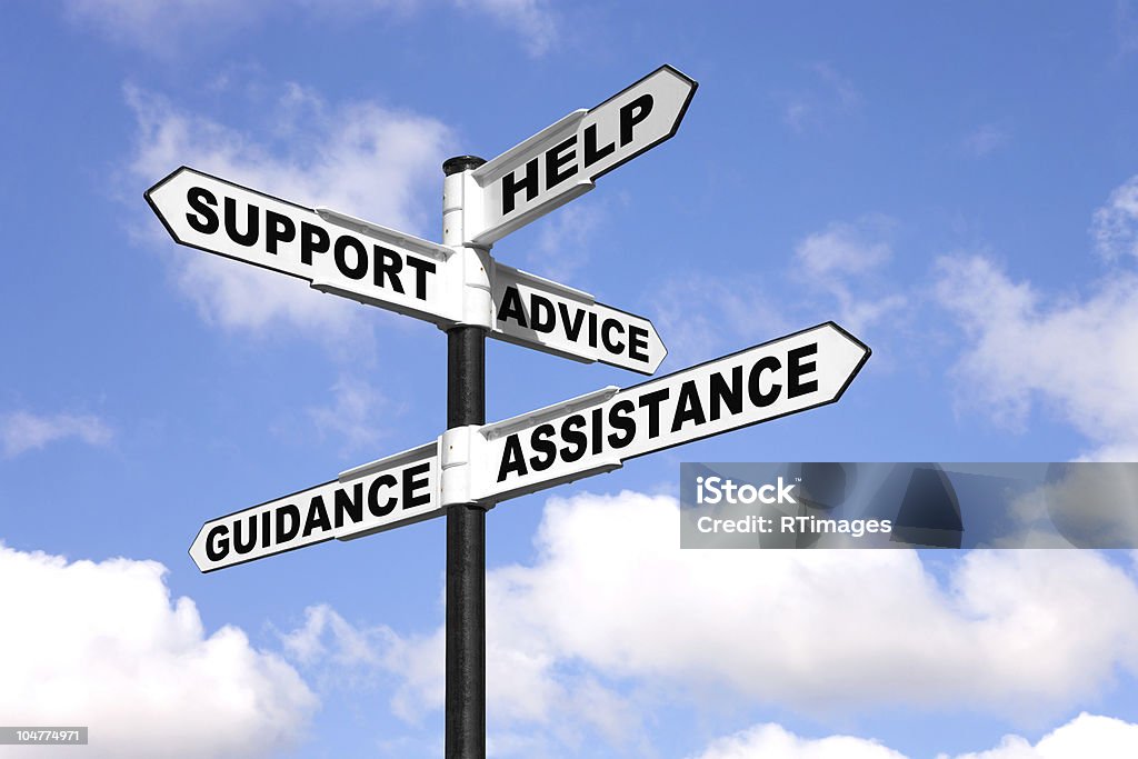 Help and support signpost Signpost with the words Help, Support, Advice, Guidance and Assistance on the direction arrows, against a bright blue cloudy sky. Support Stock Photo