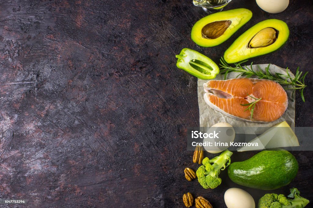 Ketogenic low carbs diet concept. Healthy balanced food with high content of healthy fats. Ketogenic low carbs diet concept. Healthy balanced food with high content of healthy fats. Diet for the heart and blood vessels. Organic ingredients, black background, copy space top view, Ketogenic Diet Stock Photo