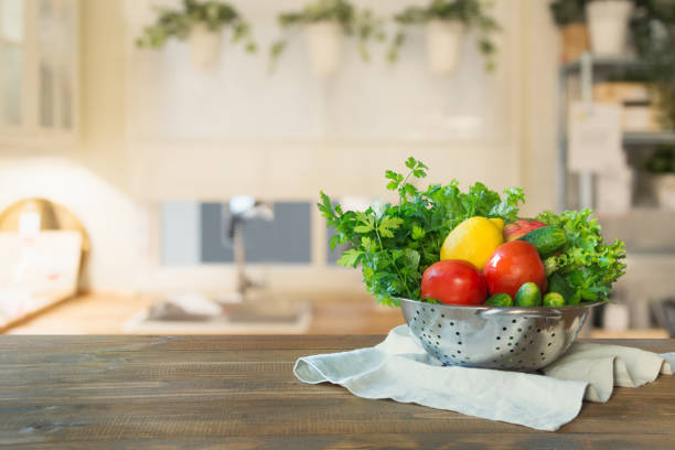 istock Blurred background. Modern kitchen with empty wooden tabletop, space for you and display your products. 1047757458