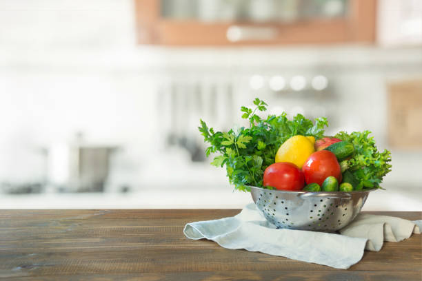 istock Blurred background. Modern kitchen with empty wooden tabletop, space for you and display your products. 1047757474