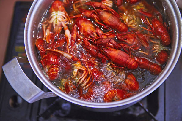 istock Crawfish cooking boiling in pot with spices 1047765576