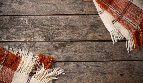 istock Autumn background with plaid and leaves 1047767382
