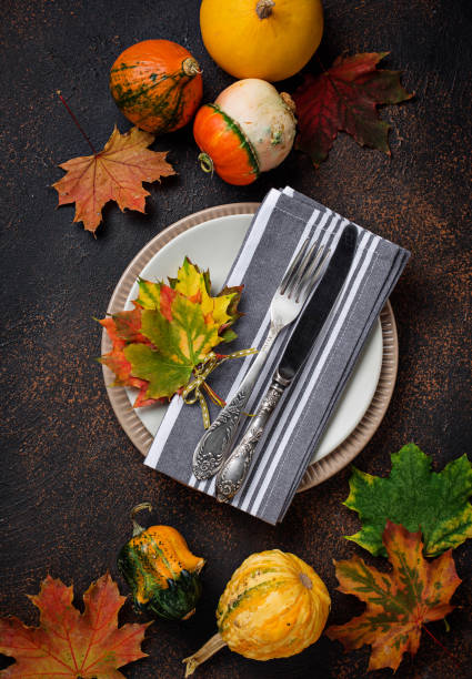 istock Autumn table setting with colorful leaves 1047768260