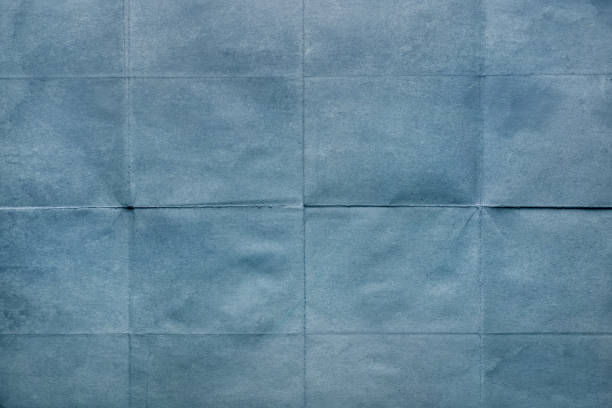 istock Blank surface, old paper sheet with creases 1047768786