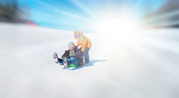 istock Father and Son Having Fun with the Sled 1047768918