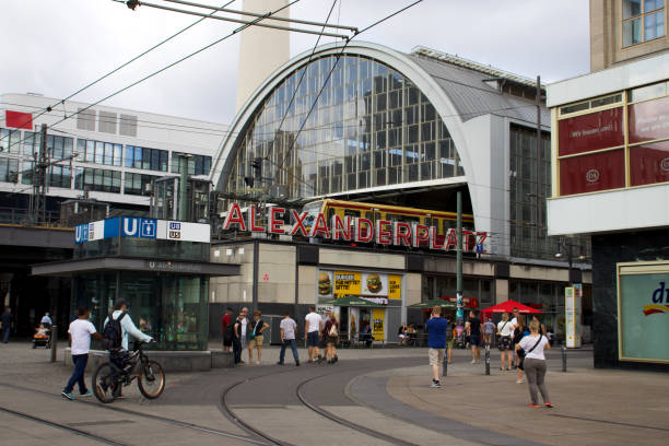 Alexanderplatz Station, Berlin Berlin, Germany: 5 August 2018 - Busy Scene at Alexanderplatz Station in the City Centre with people walking into the station berlino stock pictures, royalty-free photos & images