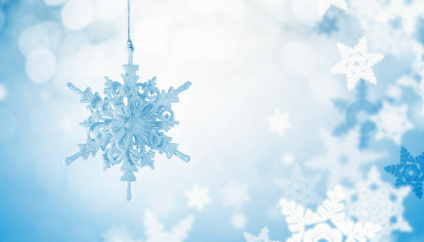istock Christmas Ornament over Snowflake Background 1047769556