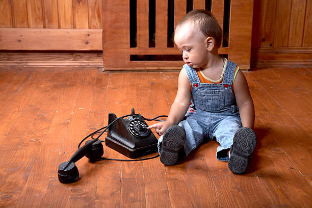 istock The little boy plays old phone 104777037
