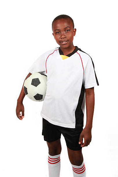 istock Young boy with a soccer ball 104777247
