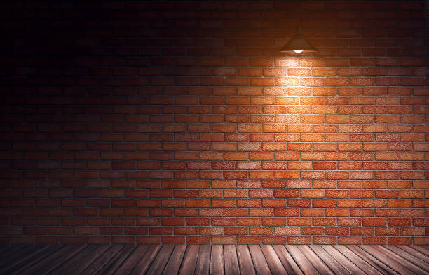 istock Red brick wall and wooden floor in rough interior. 1047774466