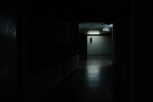 Bright light in the dark place at the midway of horror corridor