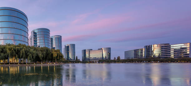 Oracle headquarters and lake with twilight sky panoramic view in Redwood Shores in California. Redwood Shores, California - September 27, 2018: Oracle headquarters and lake with twilight sky panoramic view. oracle building stock pictures, royalty-free photos & images