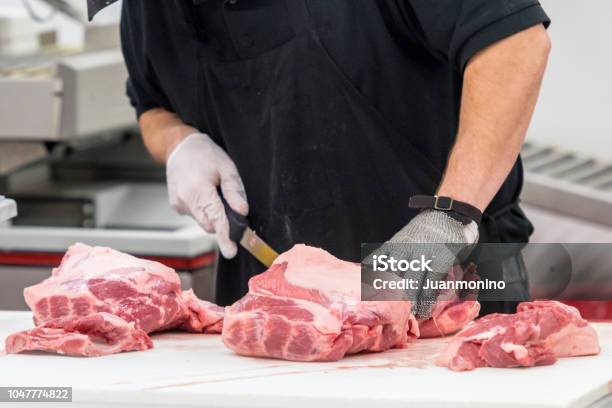 Butcher At Work Stock Photo - Download Image Now - Butcher's Shop, Butcher, Cutting