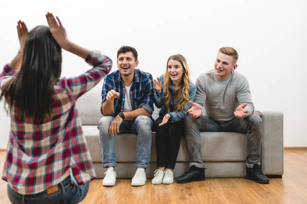 istock The four friends fun on the white wall background 1047778994