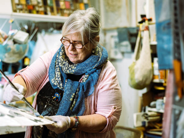 istock Senior woman artist at work 1047784192