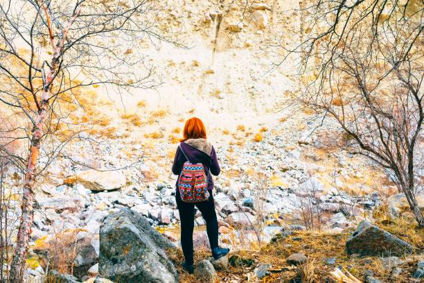 istock Hiker woman with backpack. 1047788640