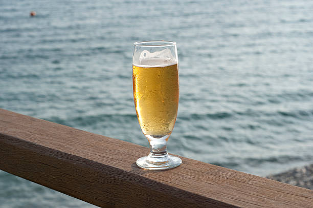 istock glass of beer on the railing 104779056