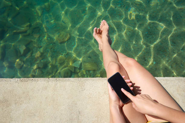 istock Woman holding smartphone 1047790958