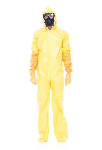 istock Man in protective clothing standing on white background 1047791242