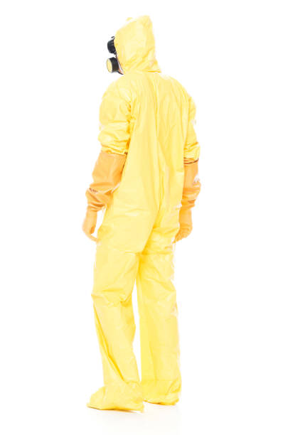 istock Man in protective clothing standing on white background 1047791248