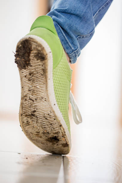 istock Walking on Clean Floor With Dirty Shoes 1047791848