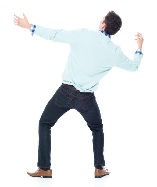istock Handsome young man looking up in surprise 1047791876