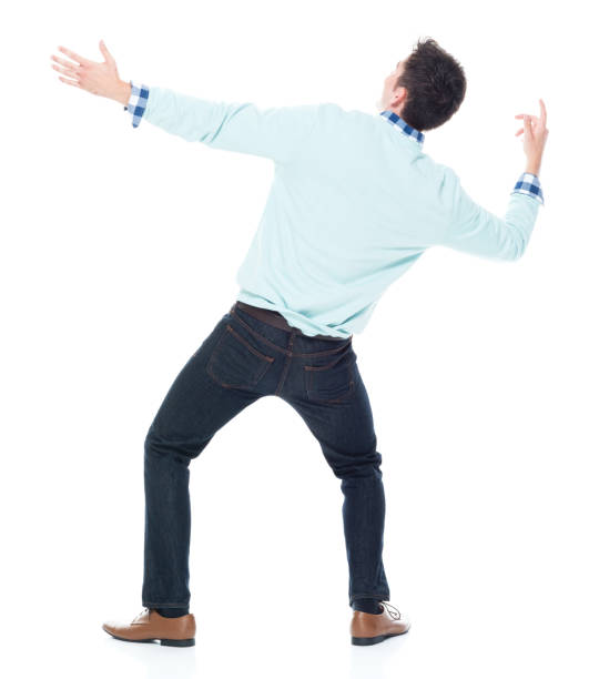 istock Handsome young man looking up in surprise 1047791880