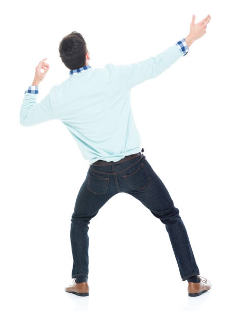 istock Handsome young man looking up in surprise 1047791890