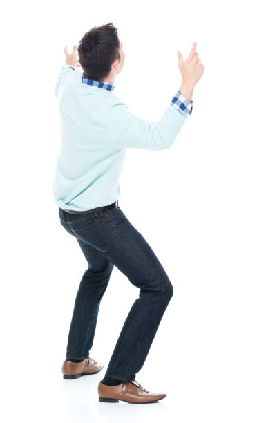 istock Handsome young man looking up in surprise 1047791896